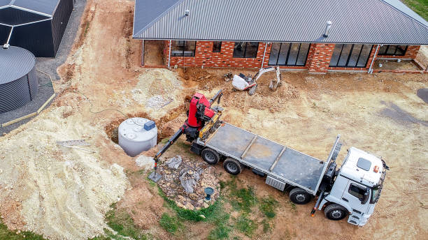 septic tank being installed next to a house